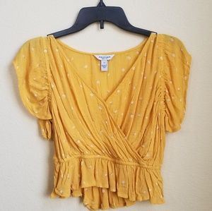 Mustard yellow blouse with small white flowers